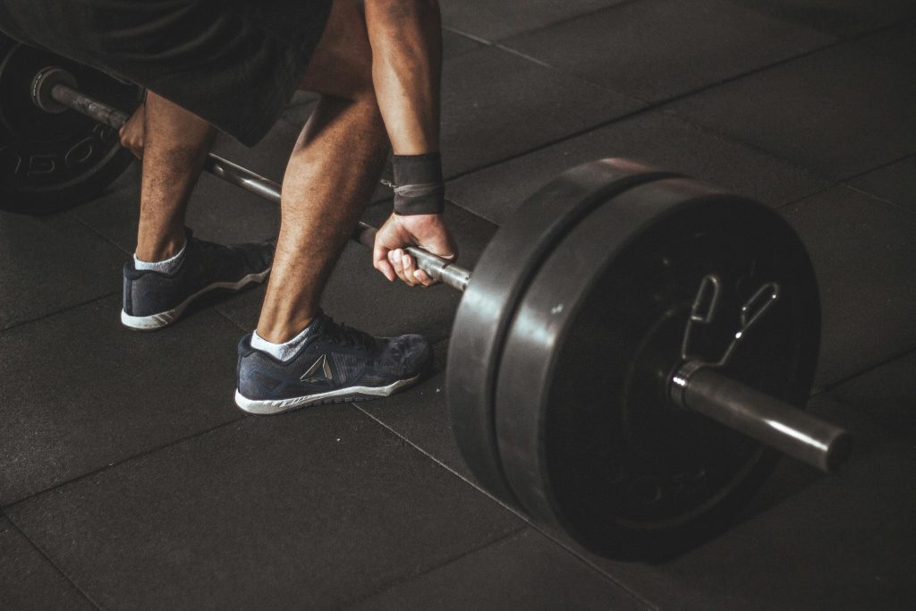 pexels-photo-949129-949129 A man lifting a heavy barbell during a gym workout, showcasing strength and fitness.